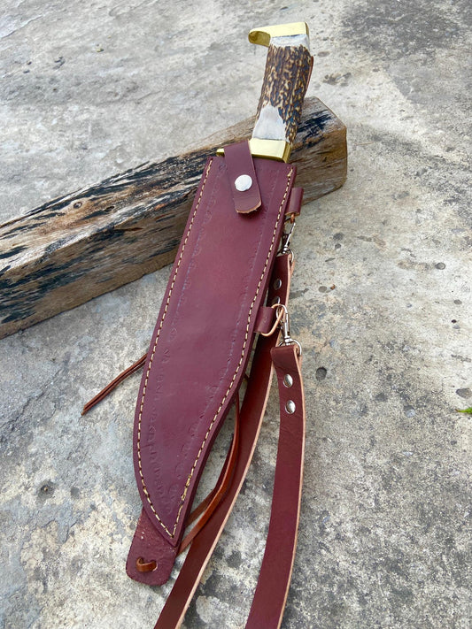 Long full-length blade shot showing the polished Bowie profile and false edge.