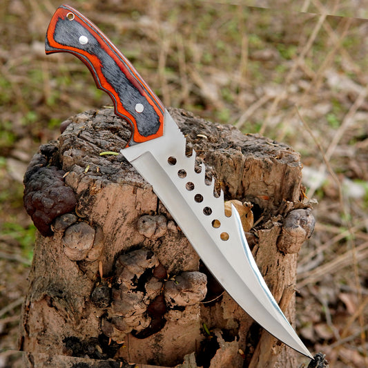 Close up of the red and black textured handle showing ergonomic finger grooves and layered material construction for a secure non slip grip. Built for long outdoor tasks and heavy use making it perfect for hunters campers and hikers.