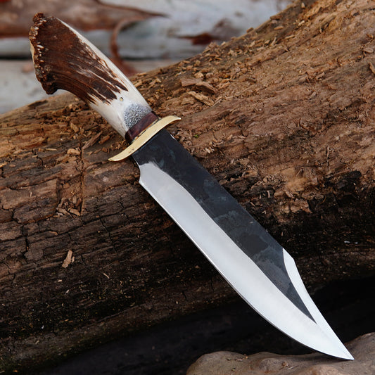 Full tang hunting knife with premium natural material handle and brass guard, crafted for durability and balanced grip.