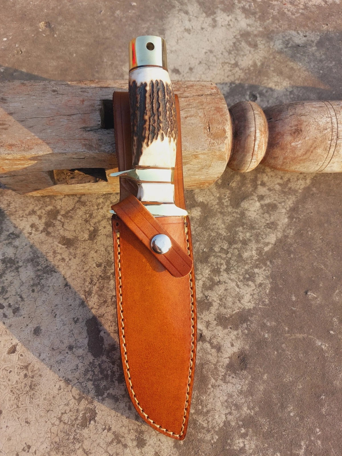 Custom hunting knife handmade with carbon steel, mirror-finished blade, natural handle, and brass guard. Includes a durable stitched leather sheath, making it a perfect choice for camping, survival, hunting, or display in a collection.