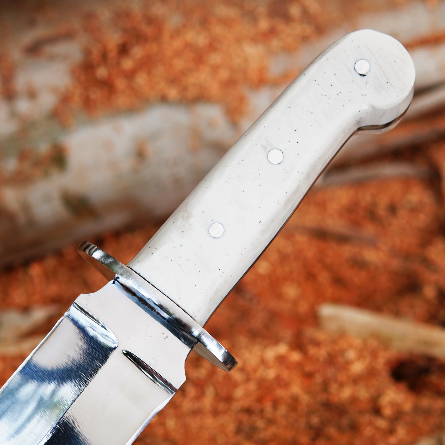 Closeup image focusing on white handle texture and grip shape providing comfortable handling and balanced control during outdoor activities while maintaining a clean modern appearance.