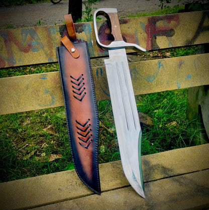 Handmade heavy D-Guard Bowie knife with carbon steel blade and rosewood handle displayed outdoors.