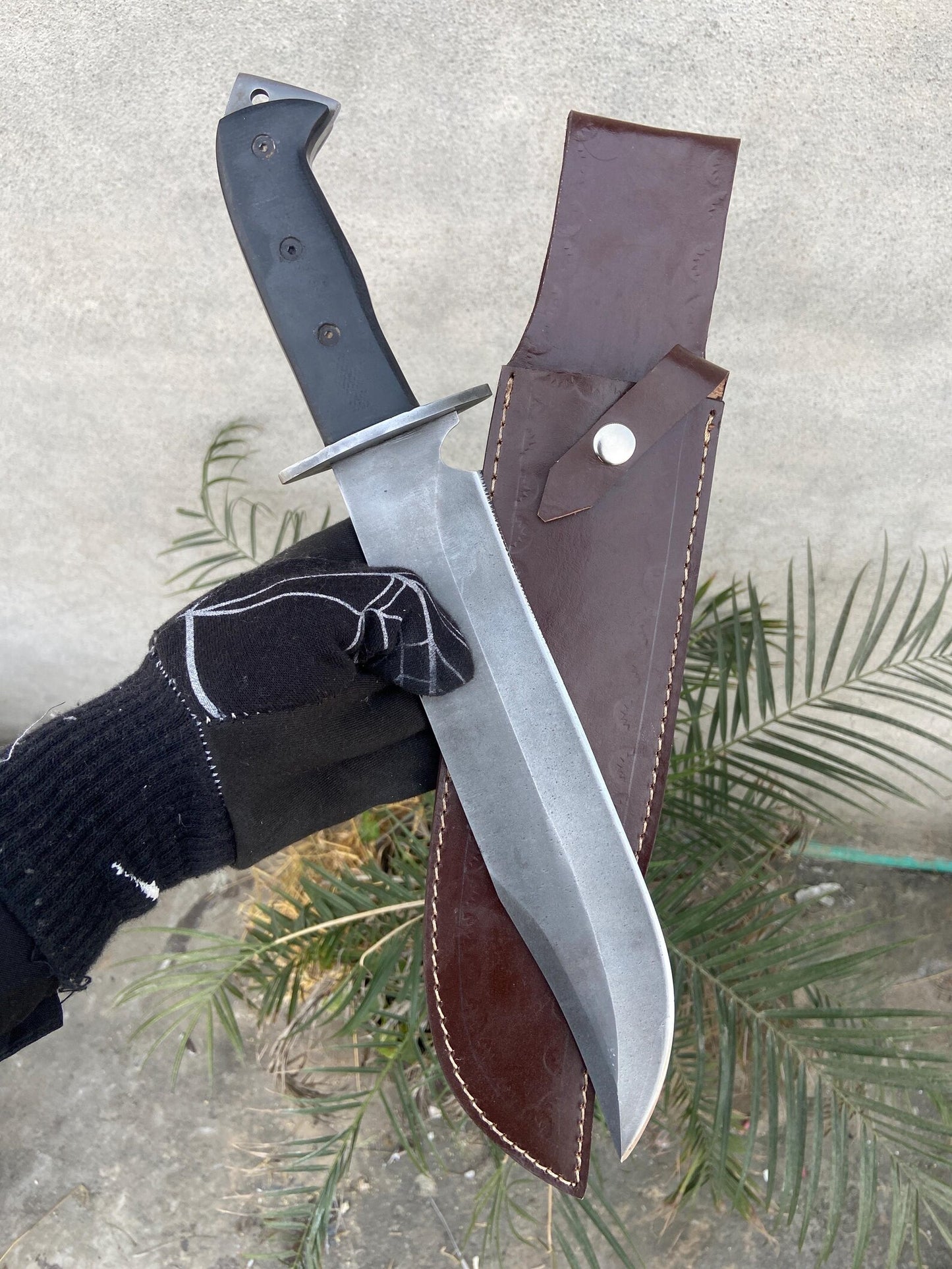 Hand forged bowie knife made from 5160 spring steel for strength and durability