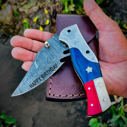 Custom engraved pocket knife demonstrating personalization options on blade and leather sheath making it a thoughtful custom gift.