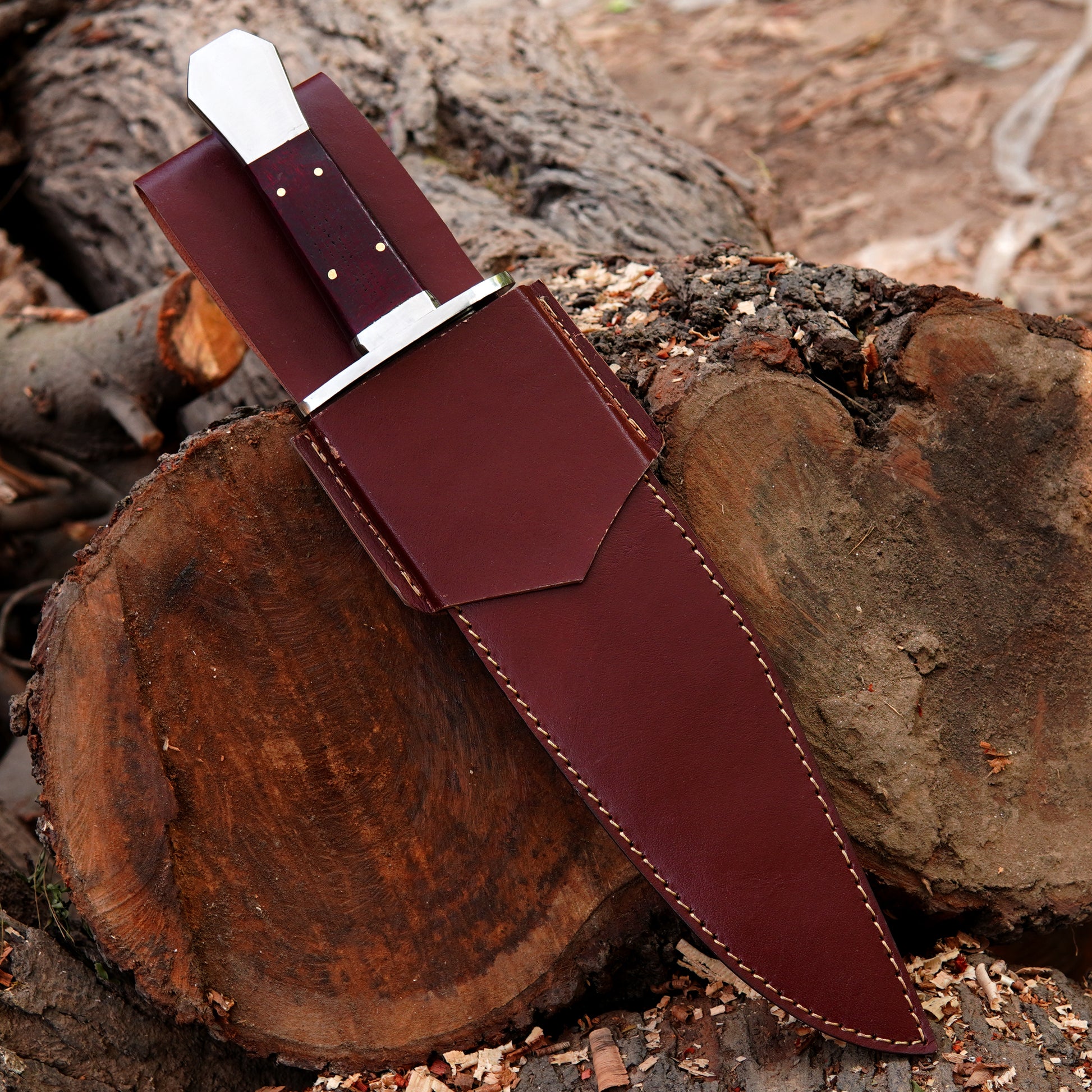 Handmade outdoor knife paired with a high-quality leather sheath for safe storage and carry.