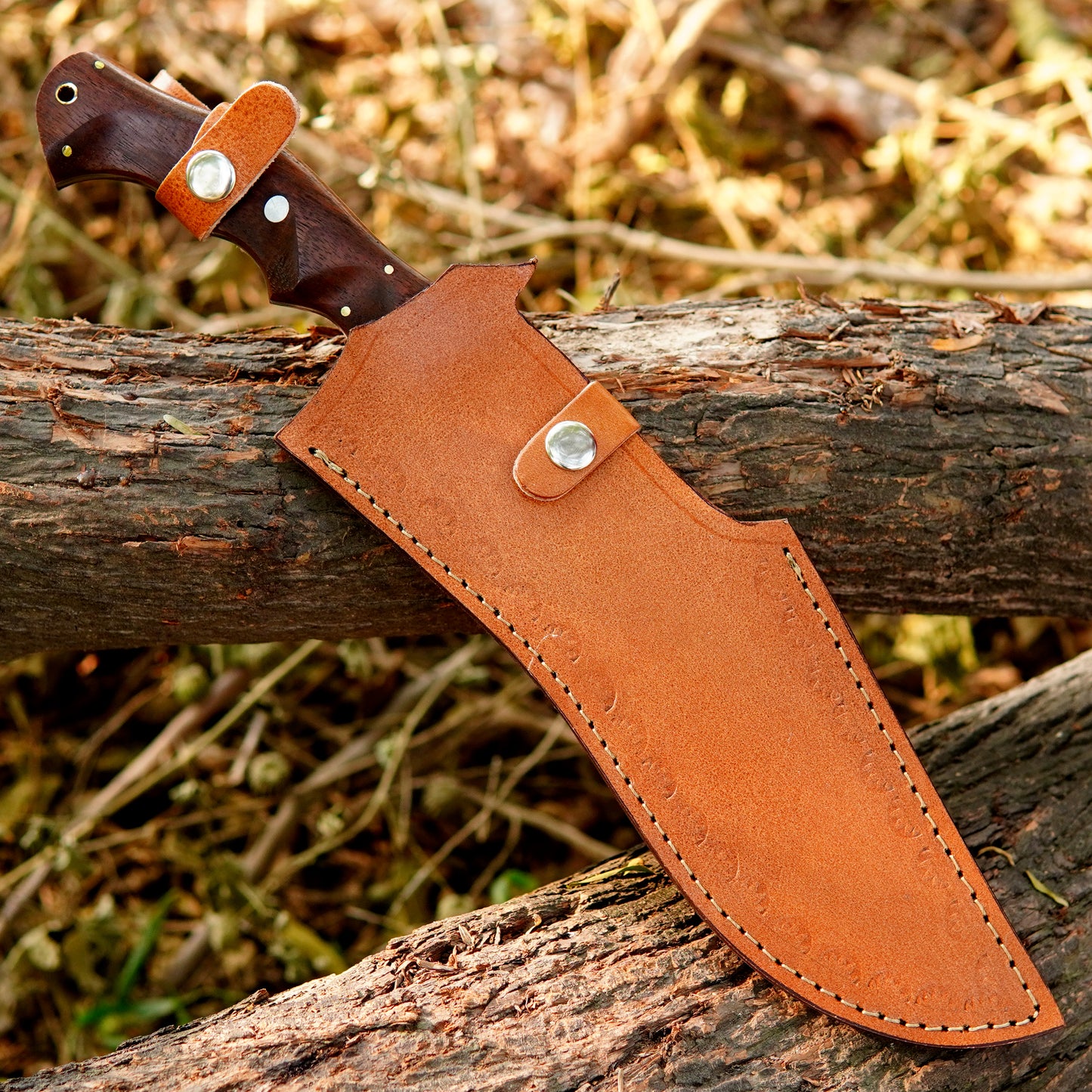 Handmade outdoor knife presented in a rustic setting highlighting balance and craftsmanship.