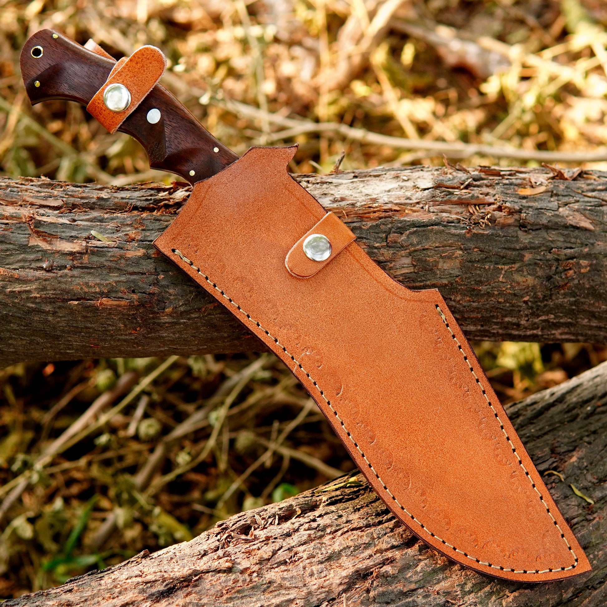 Handmade outdoor knife presented in a rustic setting highlighting balance and craftsmanship.