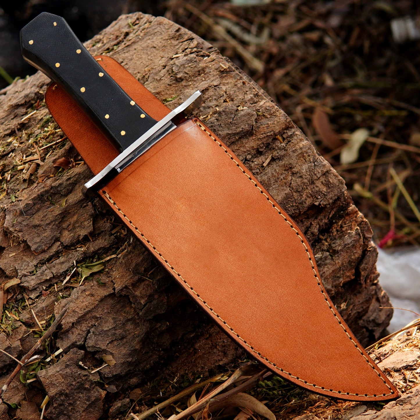 Handmade outdoor knife paired with a premium leather sheath for safe storage and carry.