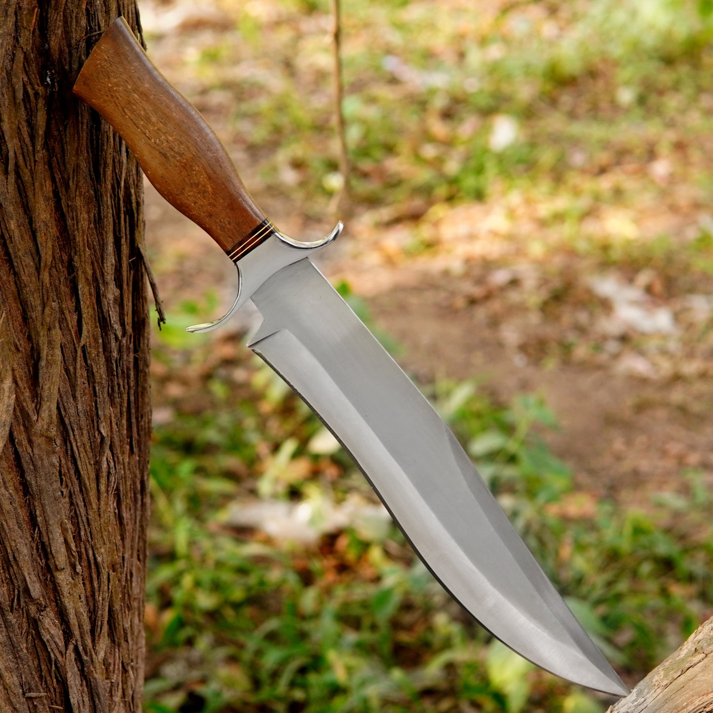 Close up view of the ergonomic wooden handle showing natural grain texture and comfortable grip shape crafted for long outdoor use reducing hand fatigue while maintaining strong control during hunting camping and bushcraft activities