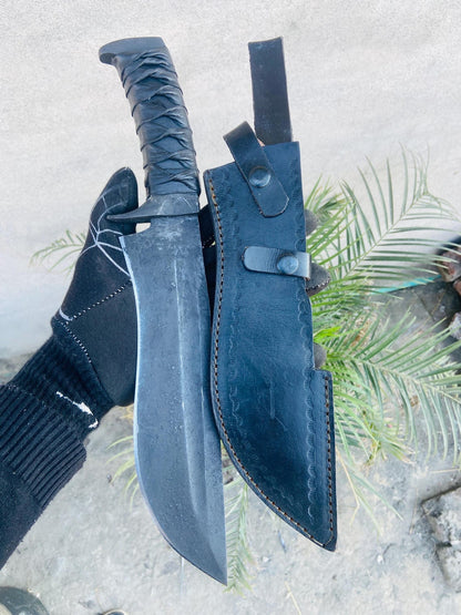 Full set display of handmade bowie knife and leather sheath ready for belt carry.