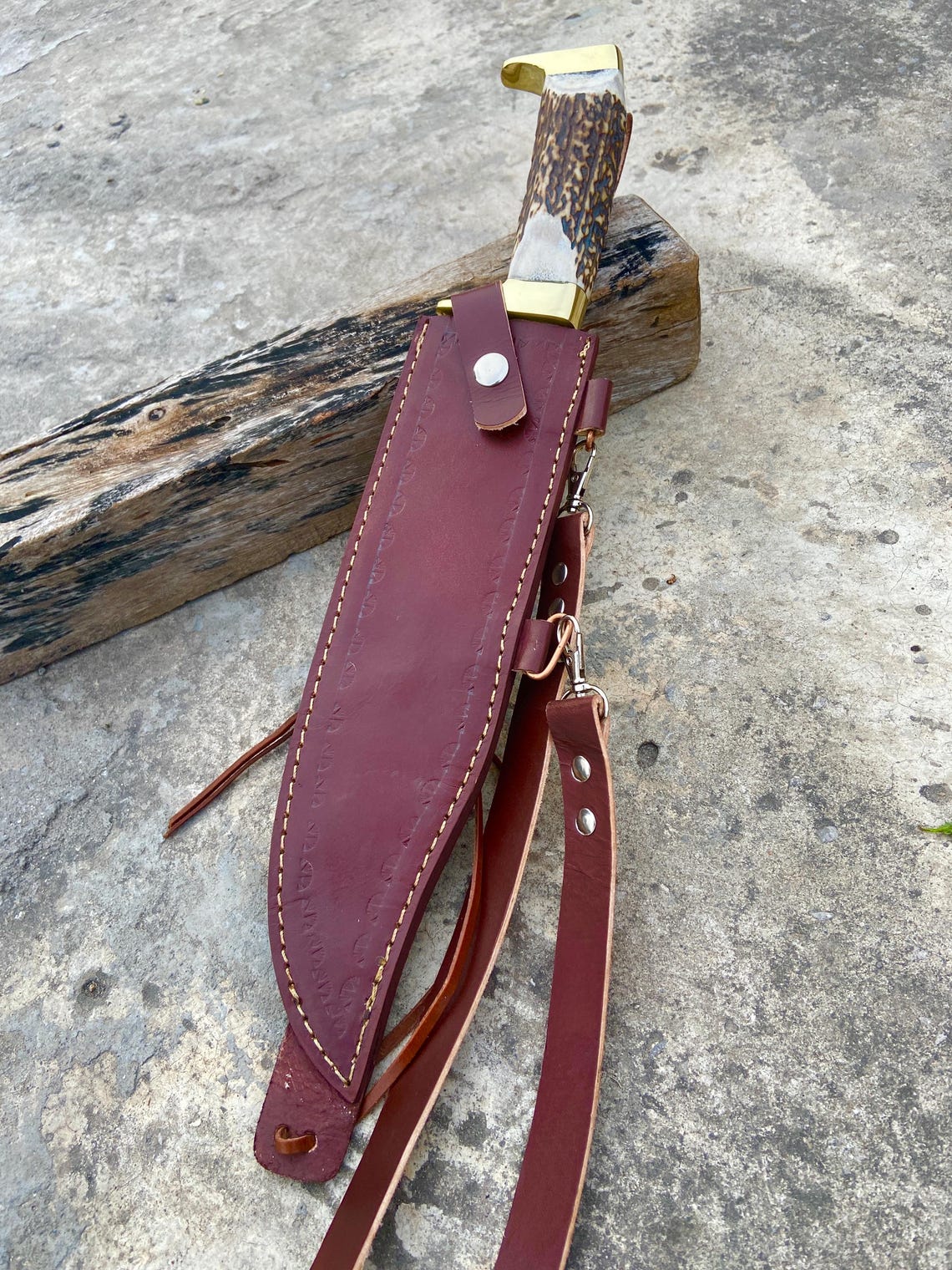 Long full-length blade shot showing the polished Bowie profile and false edge.