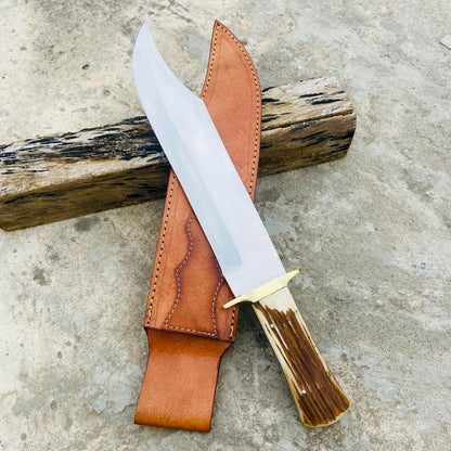 Close-up of genuine stag handle with brass guard on handmade D2 steel hunting knife.