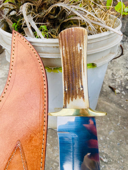 Handmade D2 bowie knife and sheath displayed as a gift for hunters and outdoor lovers.