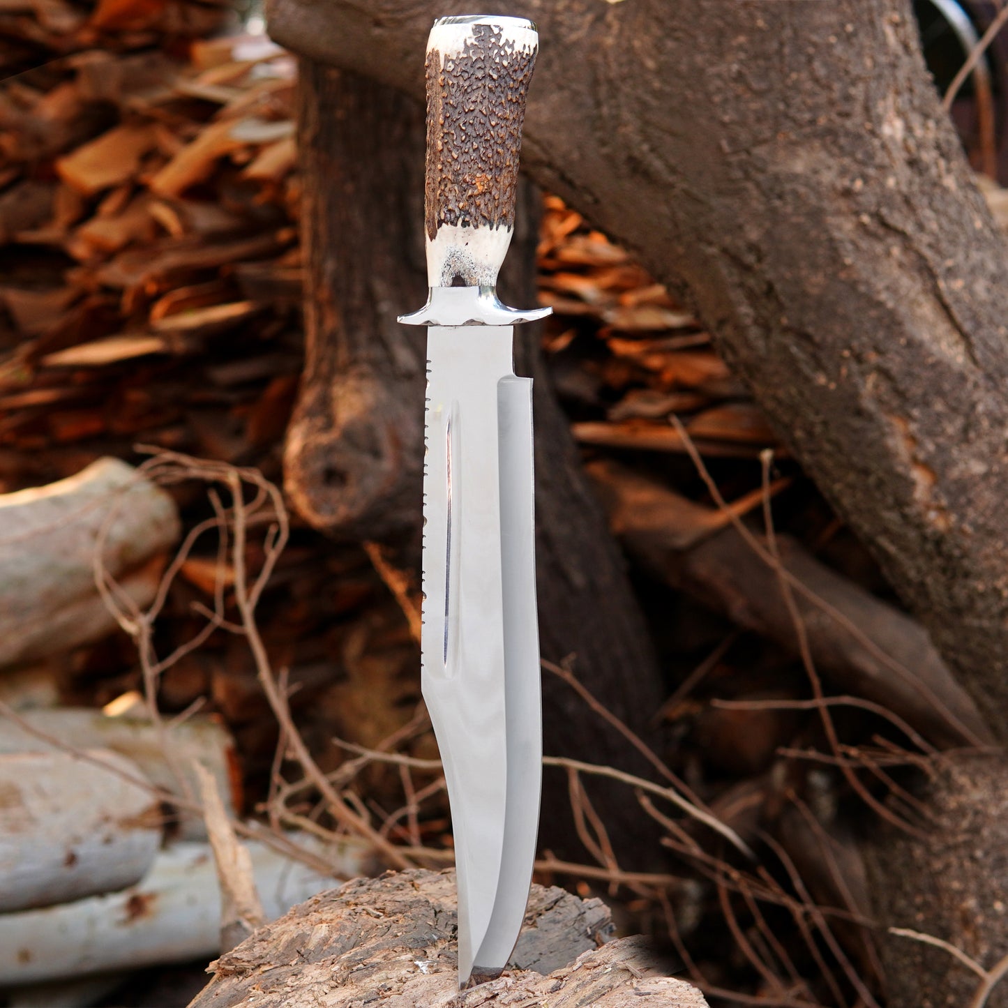 Handcrafted Bowie knife placed on stacked logs highlighting blade finish and detailed serrated spine.