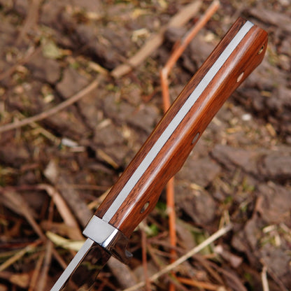 Detailed image of bowie knife handle showing natural material grip, secure pin construction and comfortable shape designed for stability and control during outdoor activities.