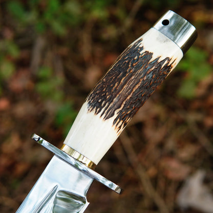 Close-up of bowie knife blade highlighting smooth polish and balanced design.