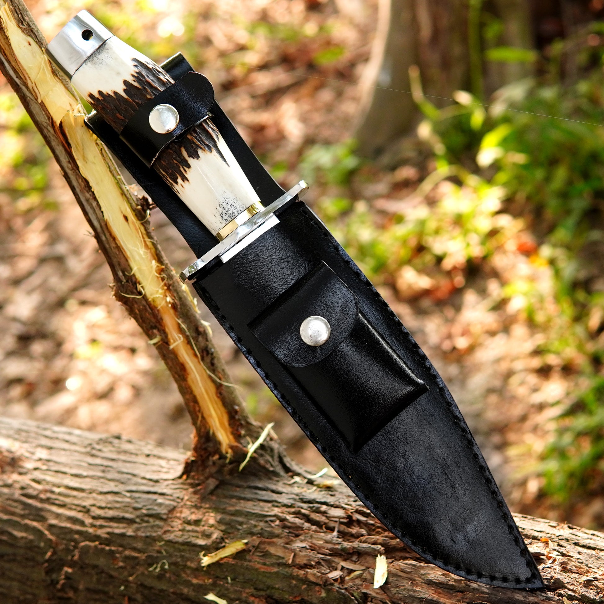 Handmade outdoor knife showing a satin finished blade with deep center fuller.