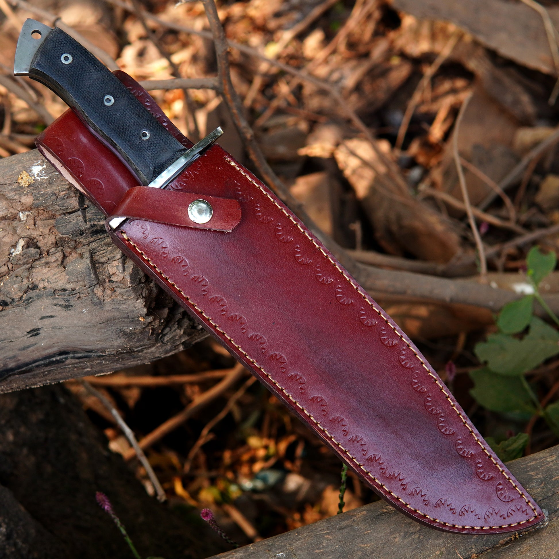 Handmade outdoor knife paired with a premium leather sheath for safe storage and carry.