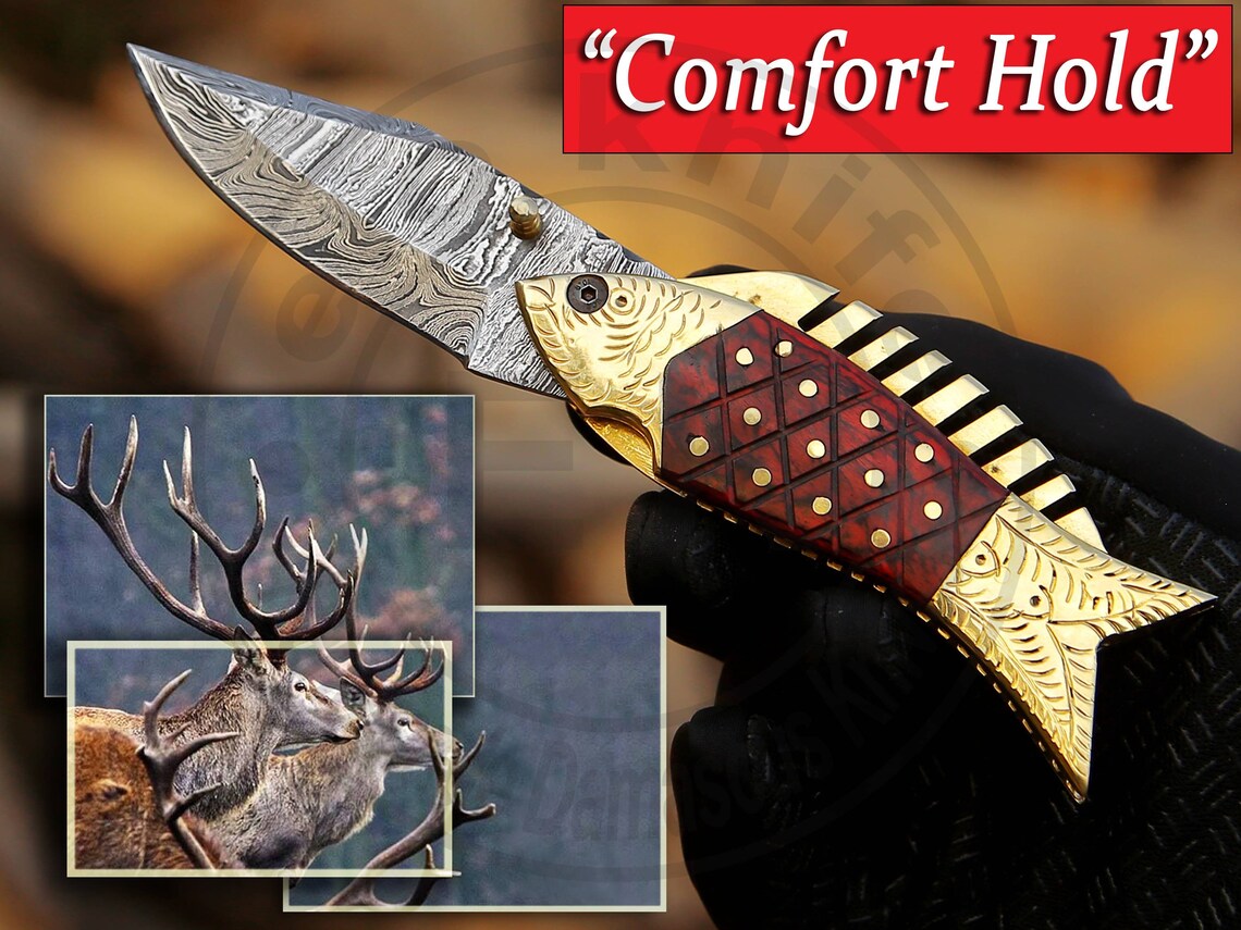 Damascus fish pocket knife showing blade pattern and red Pakka wood scales with brass frame.