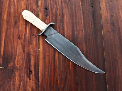 Custom handmade carbon steel Bowie knife with full tang construction, double guard, and natural camel bone handle, built for durability, strength, and outdoor performance.