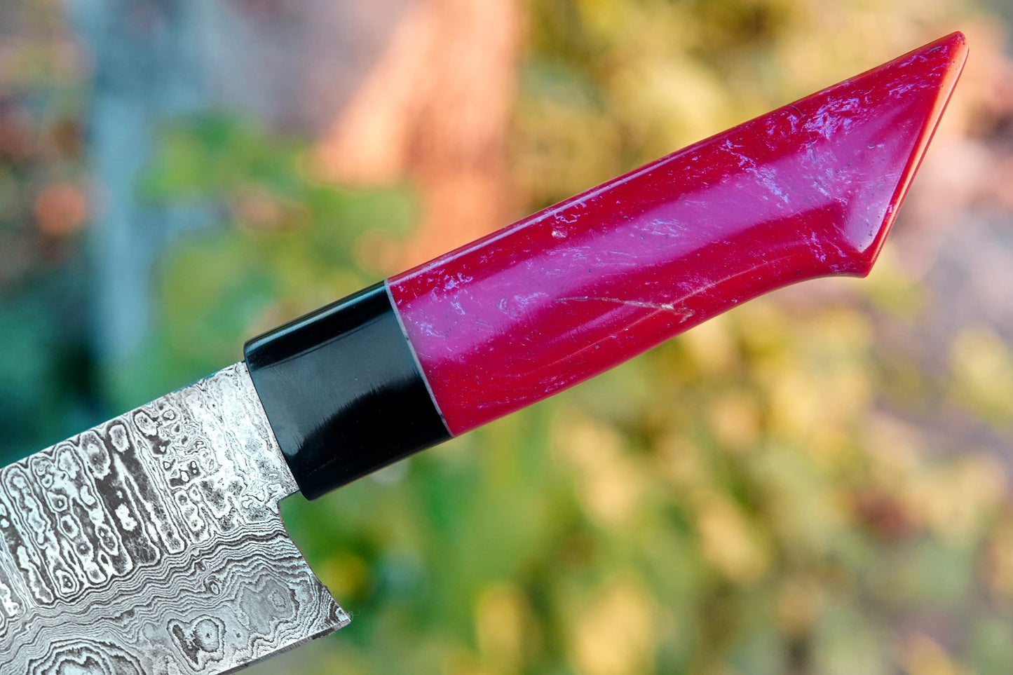 A chef knife crafted from Damascus steel with a full tang design and glossy pink resin handle. Strong, sharp, and handmade with visible Damascus layers, this knife is ideal for both kitchen cooking and outdoor BBQ. Free engraving available.