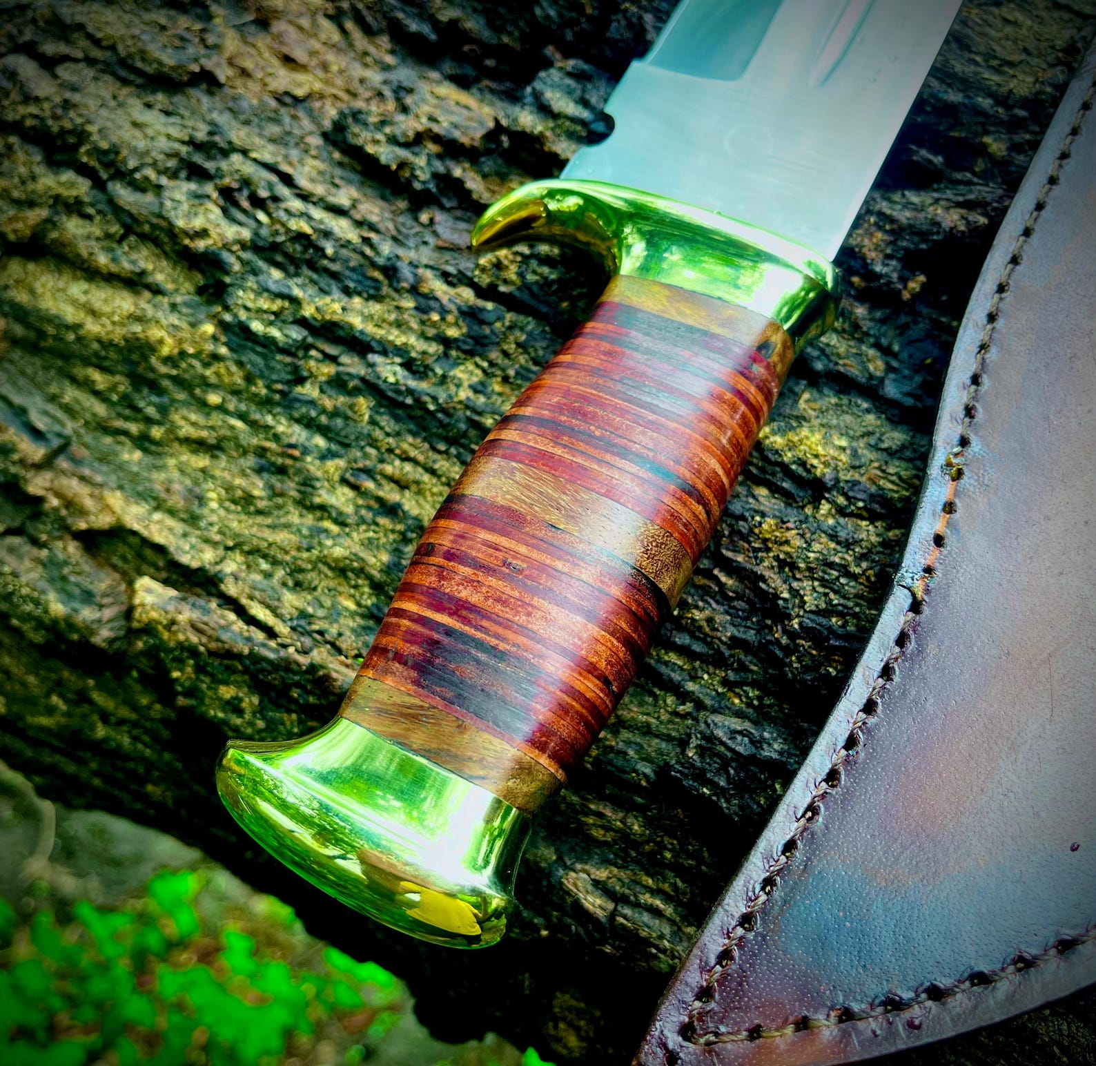 Custom handmade Crocodile Dundee Bowie knife crafted from high-quality carbon steel with a stacked leather handle for a secure grip. Includes a handcrafted brown leather sheath with snap closure. Perfect for collectors, survivalists, or anyone seeking a functional and stylish Bowie knife inspired by the famous Crocodile Dundee blade. Durable, sharp, and designed for both outdoor use and display.