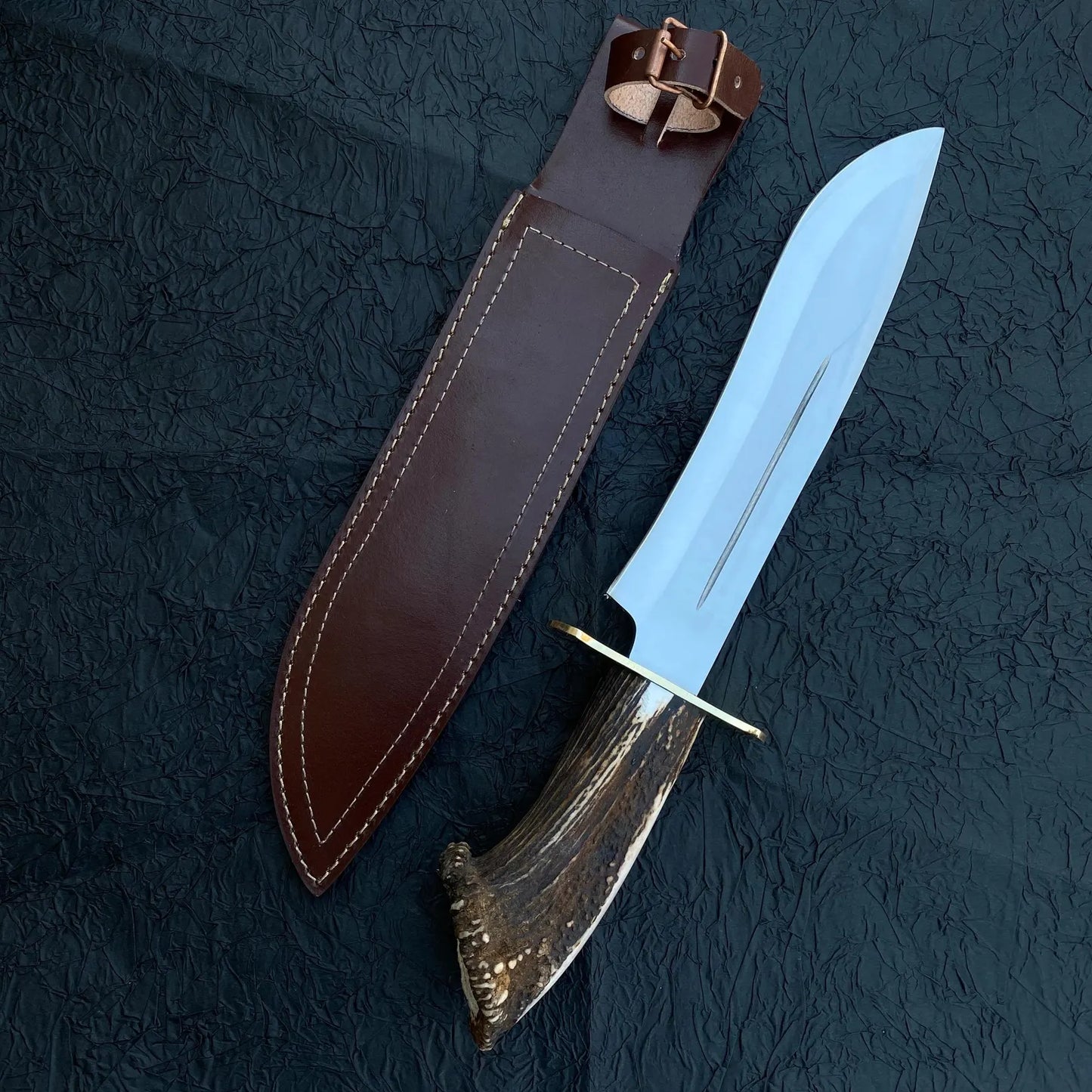 Collector Bowie knife with natural materials and brass fittings, blending functionality with timeless craftsmanship.
