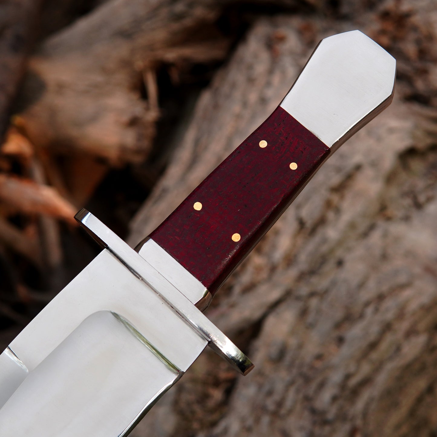 Close-up view of a polished steel blade showing clean lines and refined craftsmanship.