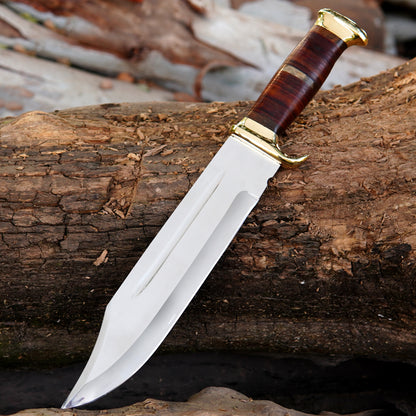 Close-up view of the custom Bowie knife blade showing its clean satin finish and deep fuller groove along the center. The blade is carefully crafted for strength and durability, offering a balanced weight and smooth cutting performance. The strong construction ensures long-term reliability for outdoor tasks. This knife comes with a handcrafted pure leather sheath, making it suitable for collectors, outdoorsmen, and those looking for a meaningful handmade gift for men.