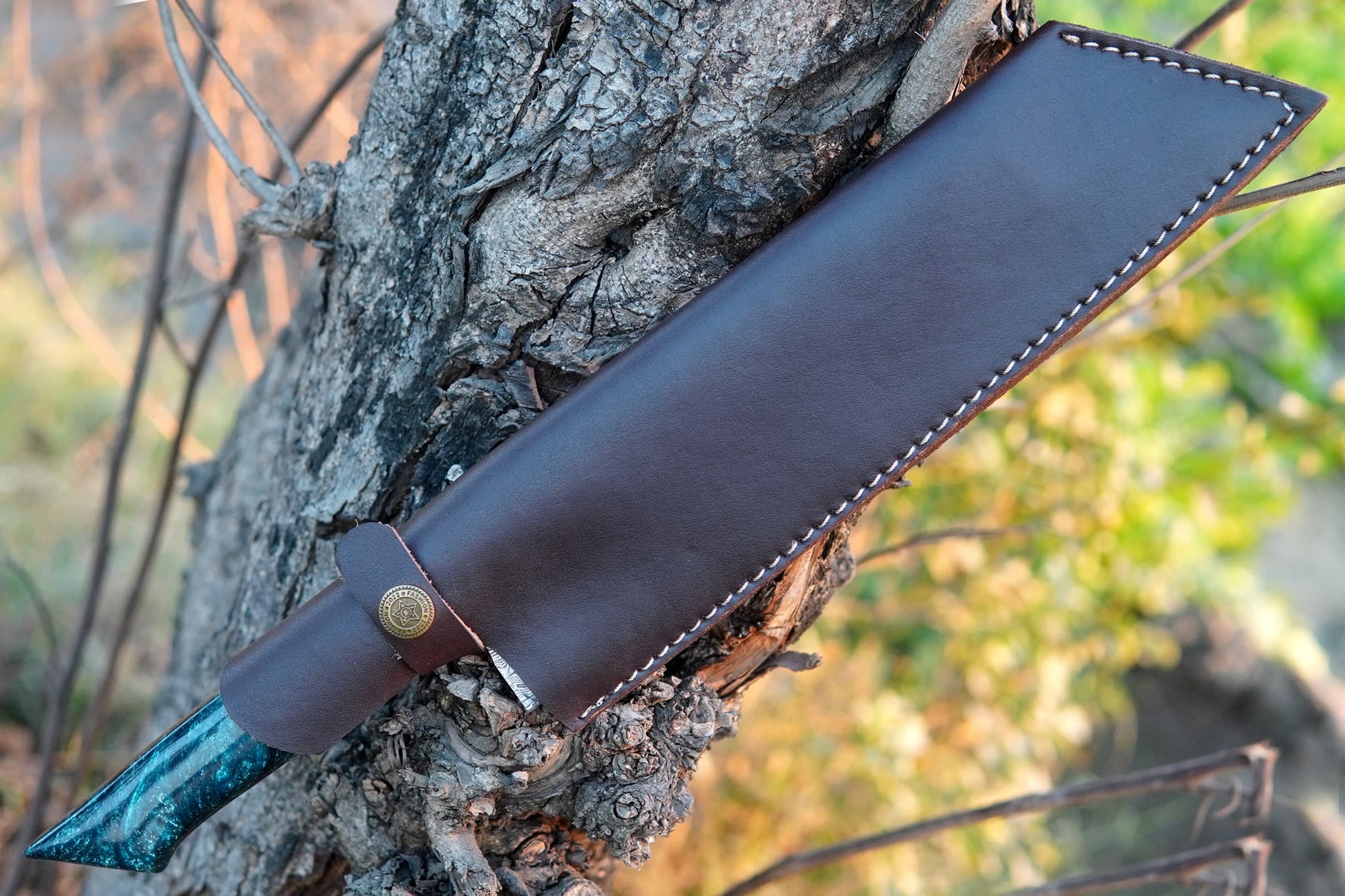 A custom chef knife handmade from Damascus steel with a resin handle. Designed for everyday kitchen chopping and outdoor cooking, this knife is durable and stylish. Free engraving lets you add initials or a message, ideal as a gift.