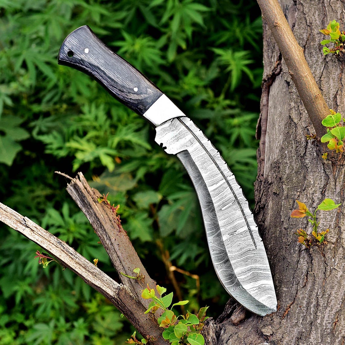 Handcrafted Damascus steel Kukri knife resting on a brown leather sheath, showcasing detailed craftsmanship, balanced design, and high-quality materials.