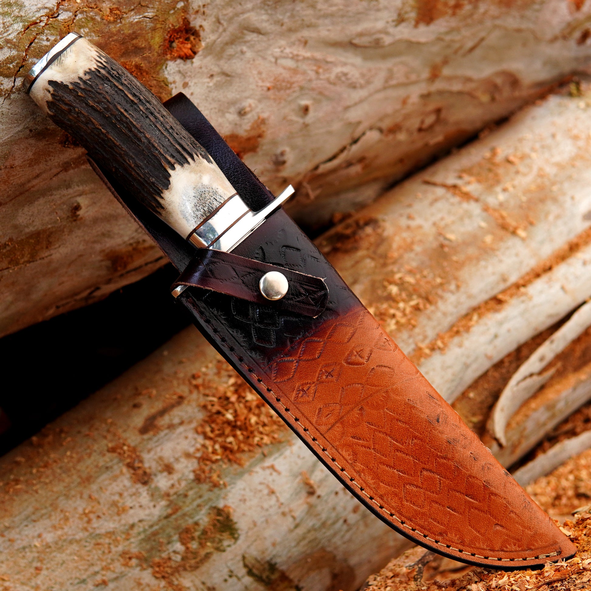Custom handmade hunting knife photographed in natural light showing detailed blade finish and strong fixed blade construction. The image presents a realistic outdoor setup that gives customers a clear idea of size, build quality, and overall design intended for camping, bushcraft, and outdoor adventure use.