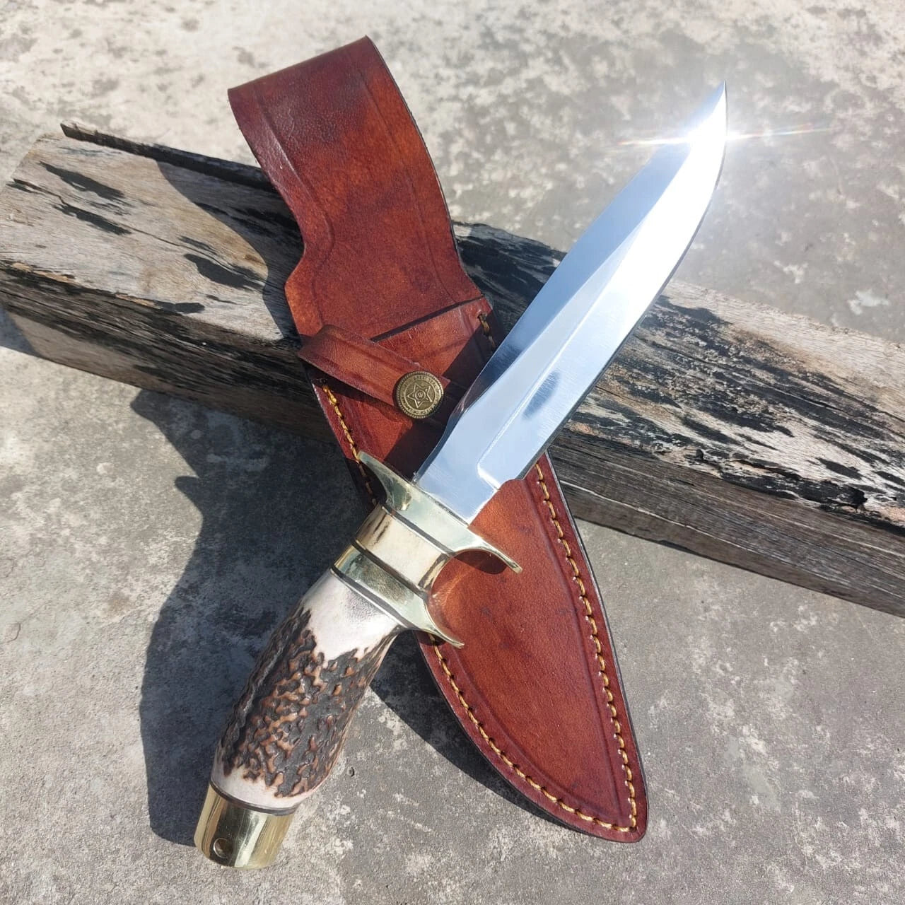 Collector high carbon steel hunting knife with subhilt design, handmade brass guard, and leather sheath. Crafted for outdoor reliability and collectible beauty, this knife offers balance, strength, and functionality.