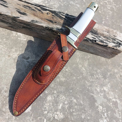 Outdoor hunting knife featuring a mirror-polished blade, brass fittings, and smooth white handle for comfort. Comes with a stitched leather sheath, designed for durability and ease of carry.