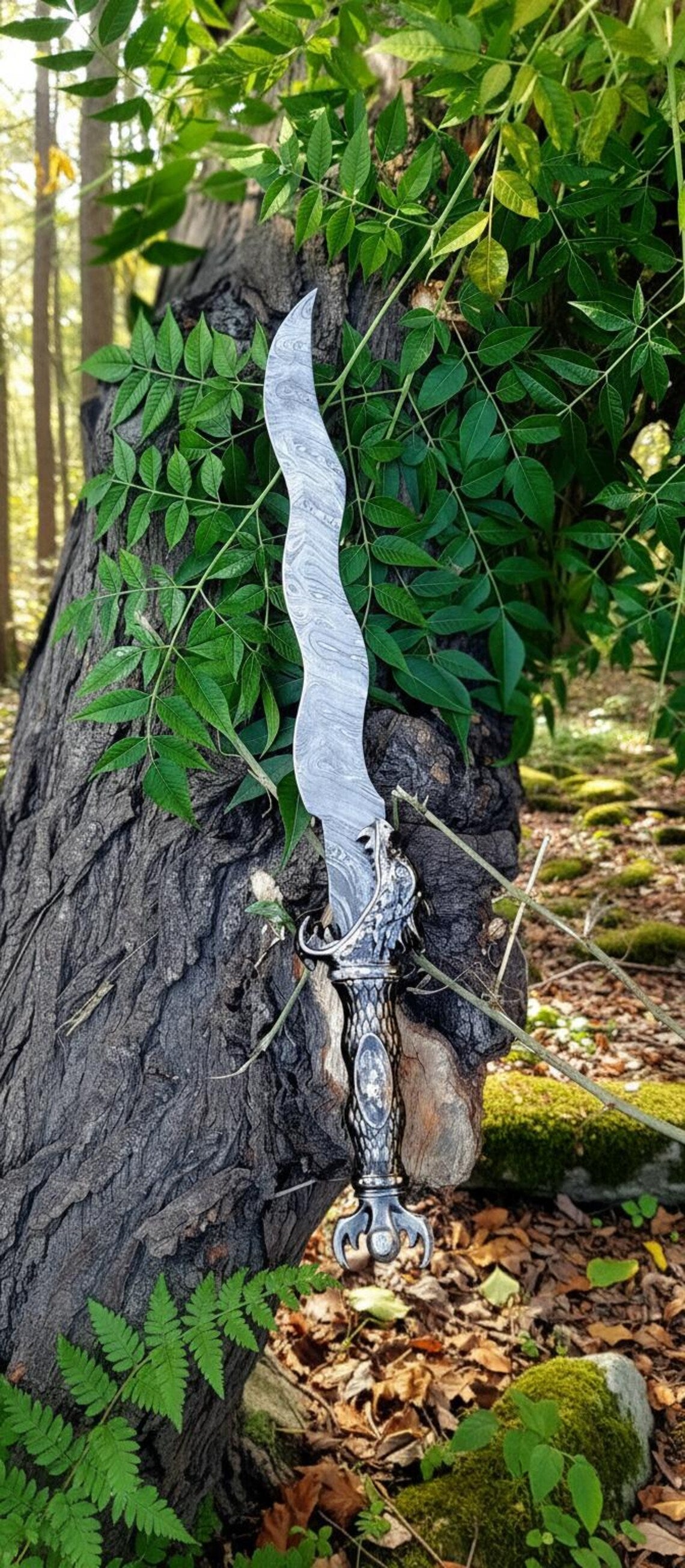 Blade texture highlighting wavy Damascus steel patterns and hand-forged finish.