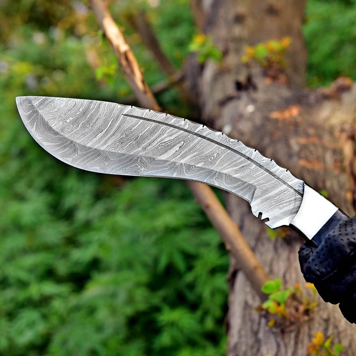 Damascus Kukri knife with a strong layered blade pattern and ergonomic Micarta handle, ideal for field, survival, or collection purposes.