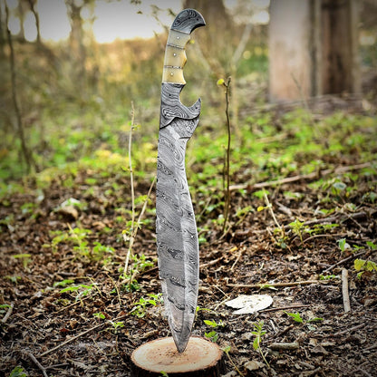 Handmade Damascus steel Kukri knife with full tang construction and polished camel bone handle, featuring a beautiful wave pattern along the blade. Perfect for survival, hunting, or outdoor use, this handcrafted Bowie-style Kukri offers power, balance, and premium craftsmanship for collectors and adventurers alike.