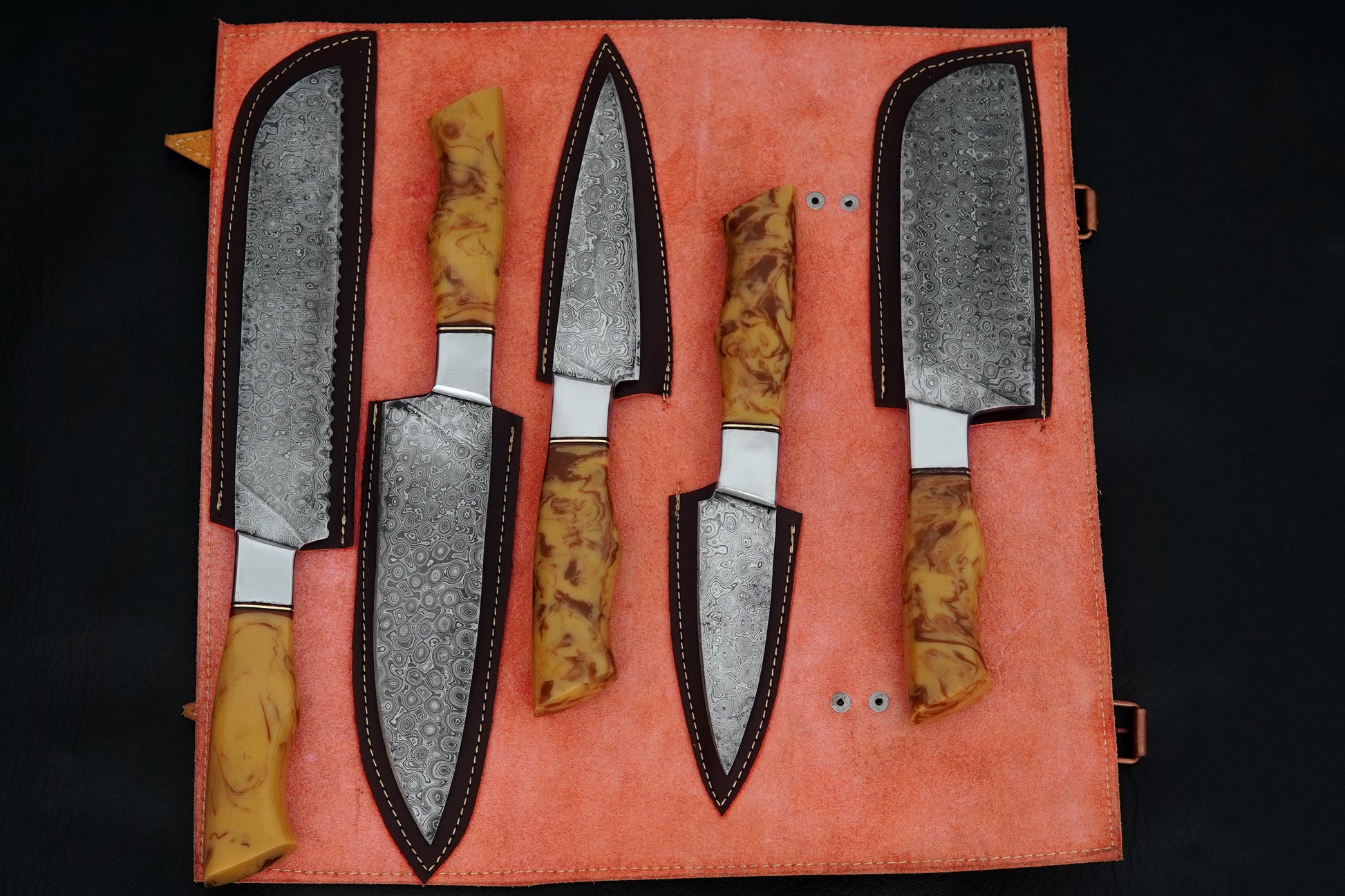 This 5 piece chef set is handmade from Damascus steel with elegant yellow resin handles. Designed for professional chefs and home kitchens, the set comes with a leather sheath for safe storage. Free engraving makes it a personalised and unique chef set.