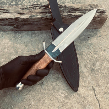 Dagger knife with polished blade and handmade black leather sheath.