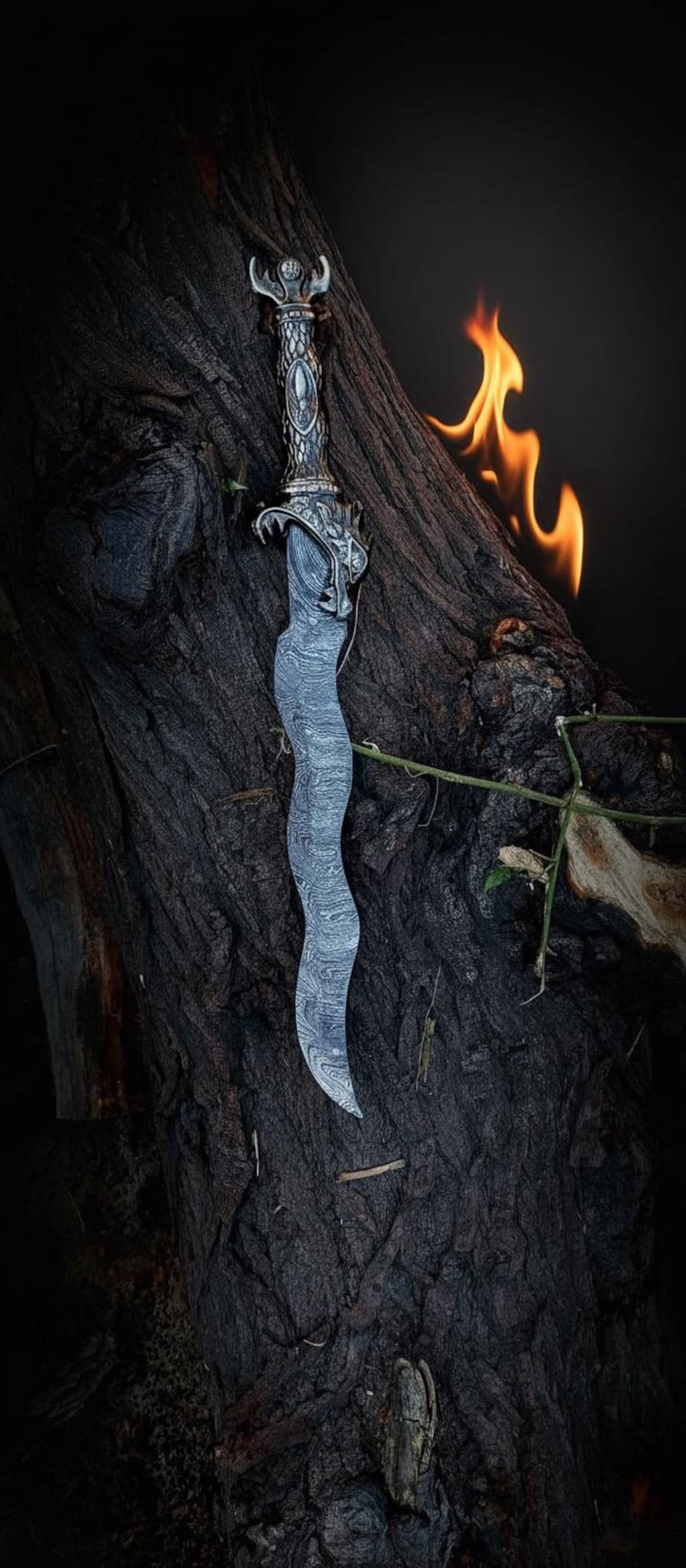 Outdoor nature scene of the antique Damascus curved knife emphasizing fantasy adventure vibe.