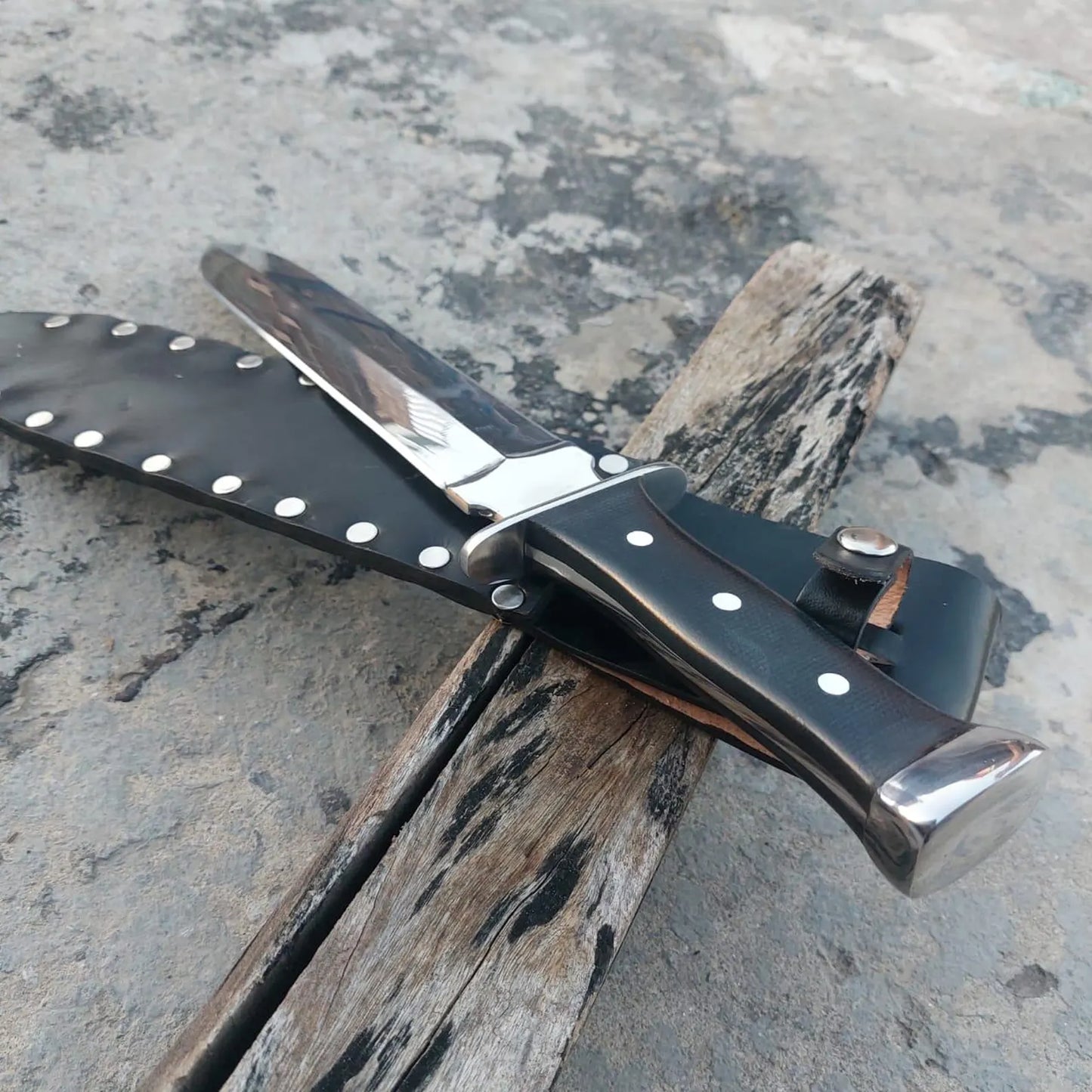 Single handed sword displayed on a wooden stand.