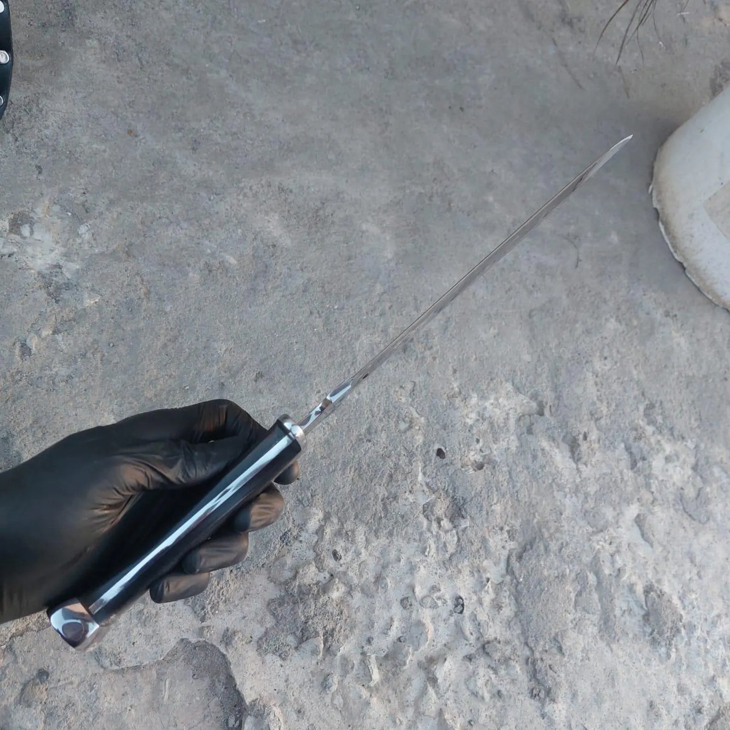 Handmade short sword alongside premium leather scabbard.