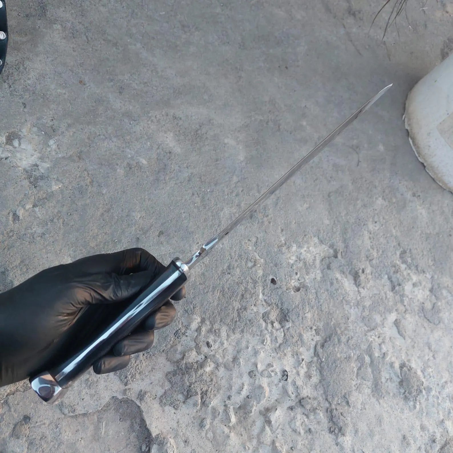 Handmade short sword alongside premium leather scabbard.