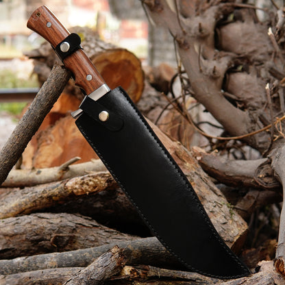 Close up view of fixed blade bowie knife showing smooth polished finish and sharp edge designed for outdoor performance, durability and long term use in camping environments.