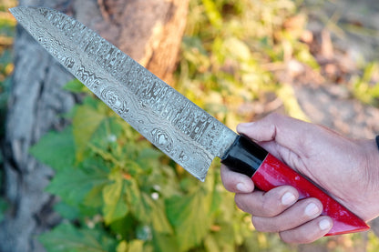 This forged Damascus chef knife comes with a vibrant pink resin handle and true layered steel blade. Handmade for strength and balance, it works perfectly for outdoor cooking, camping, or daily kitchen use. Free personalisation is offered.