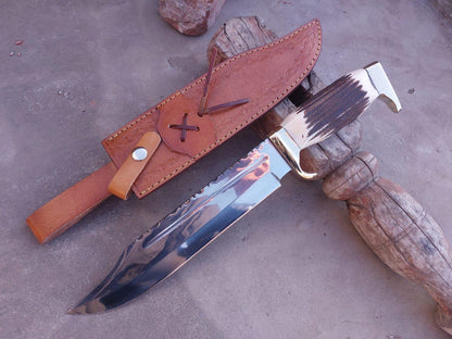 Detailed shot showing mirror finish and spine pattern of the carbon steel Bowie blade.