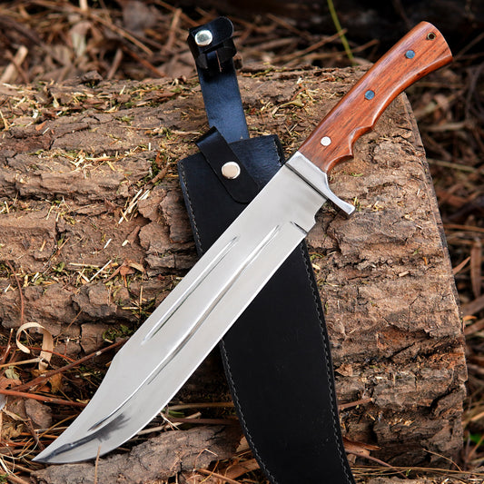 Handmade bowie knife with polished fixed blade placed on natural wood background showing full tang construction and ergonomic handle design suitable for outdoor camping and bushcraft activities.