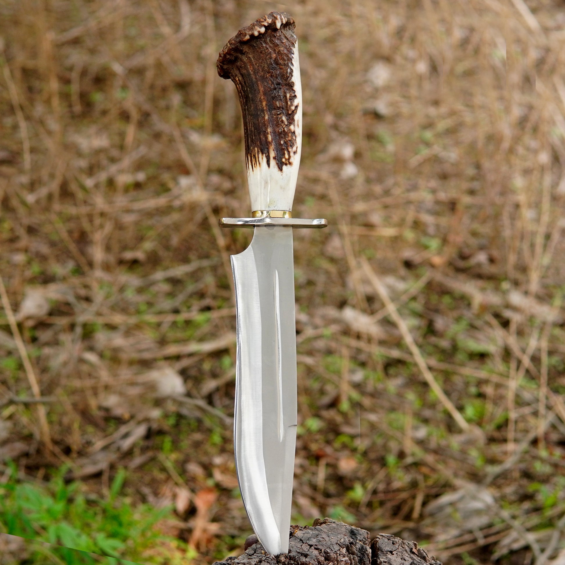 Outdoor lifestyle image showing knife ready for field use with natural background, representing practical everyday survival gear for campers fishers and explorers