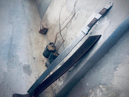 Long handmade Damascus Viking sword with decorative blade and leather sheath.