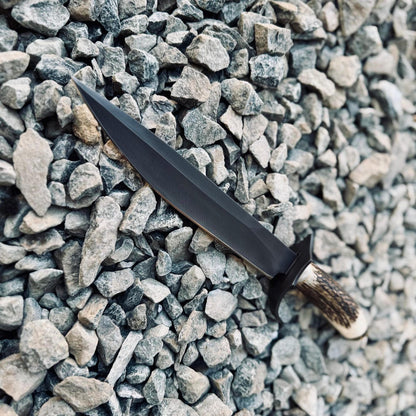 Outdoor Bowie knife with natural stag handle and 5160 spring steel blade, ideal for survival, bushcraft, and camping. Includes handmade stitched leather sheath.